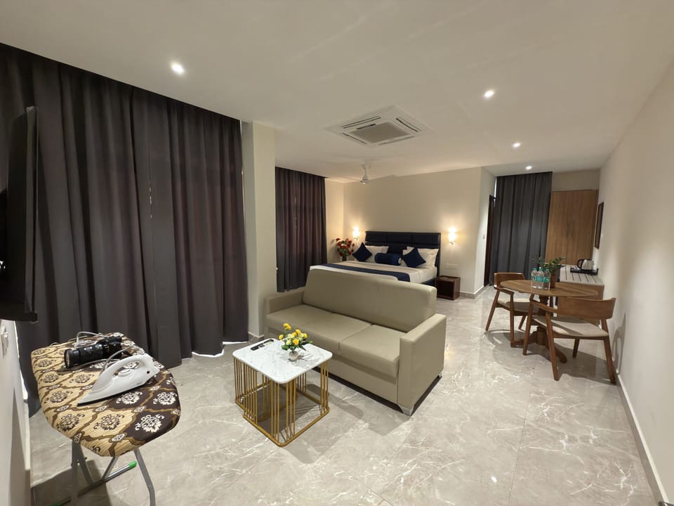 Luxury Suite, Balcony, City View | In-room safe, desk, laptop workspace, blackout drapes