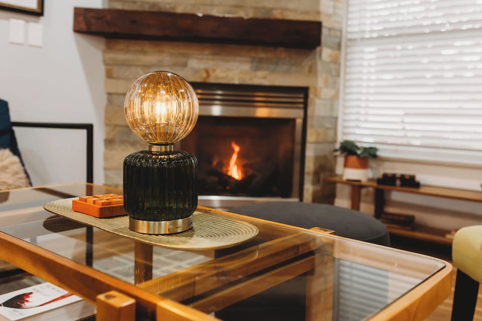 Warm welcome! 🔥 Step through the beautiful wood door and straight into the comfort of your living room, complete with a Flickering Gas Fireplace for instant ambiance. Enjoy Easy Self Check-In and the inviting feel of this Craftsman Retreat in DTWN. 