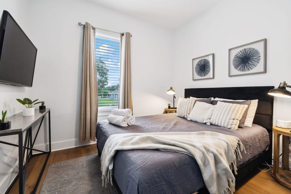 Bedroom 2: Soft linens, warm light, and quiet nights—your dreamy escape awaits.