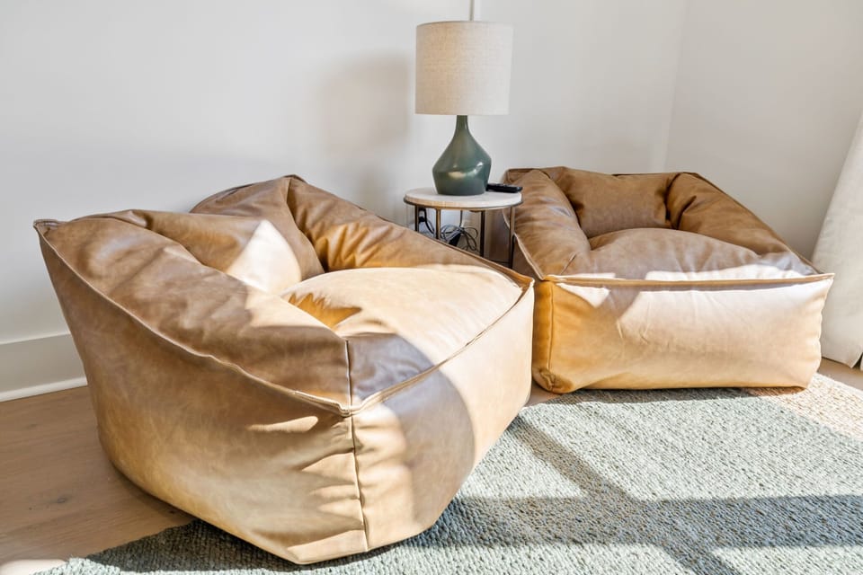 Bedroom 2: Modern comfort with a playful twist — unwind in this warm, inviting bunk room built for connection and rest.