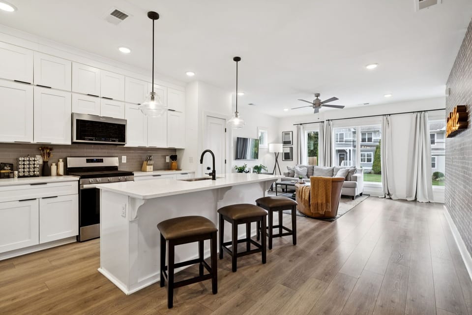 Kitchen: Sun-filled and social! The kitchen flows seamlessly into the living space, creating a welcoming atmosphere for gatherings.