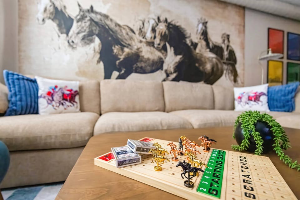 Living Room: Cozy up in this inviting living room with comfortable seating, warm natural light, and a relaxed atmosphere, perfect for unwinding after a full day of exploring.