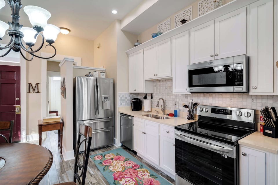 Kitchen: Functional kitchen with essential appliances and cookware.