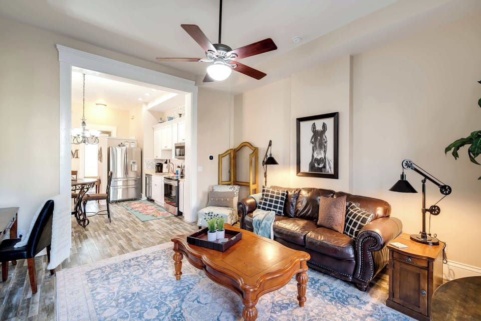 Living Room: Bright living room filled with natural light and comfortable seating.