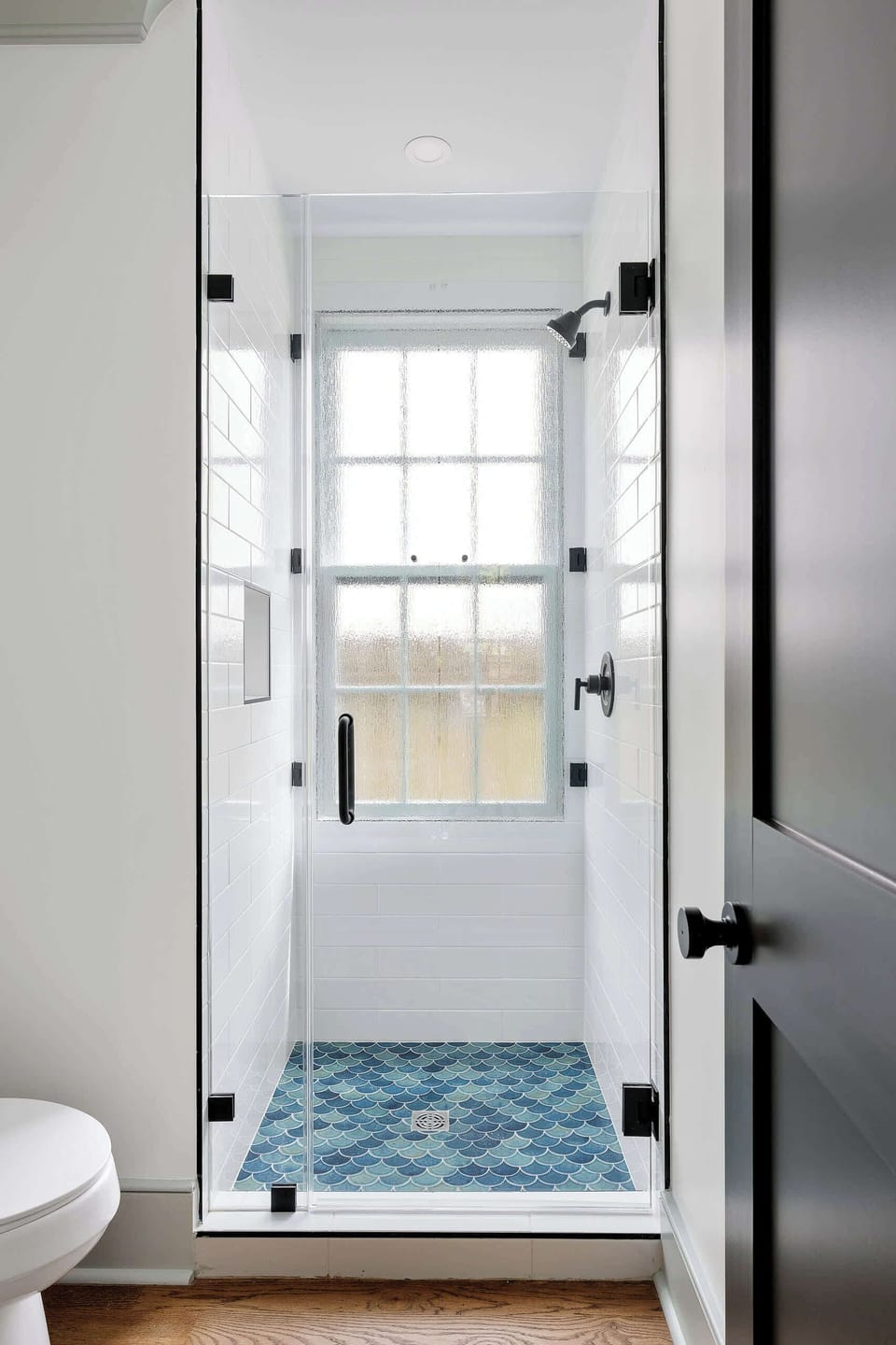 Bathroom 1: Modern bathroom featuring a spacious walk-in shower.
