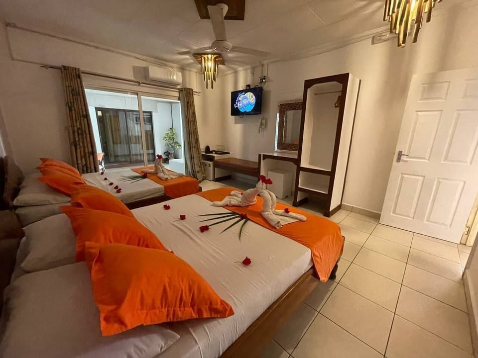 Standard Quadruple Room, 2 Queen Beds | Minibar, in-room safe, desk, WiFi (free)