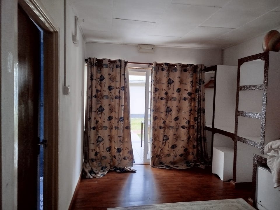 Standard Quadruple Room, 2 Queen Beds | Living area | Flat-screen TV
