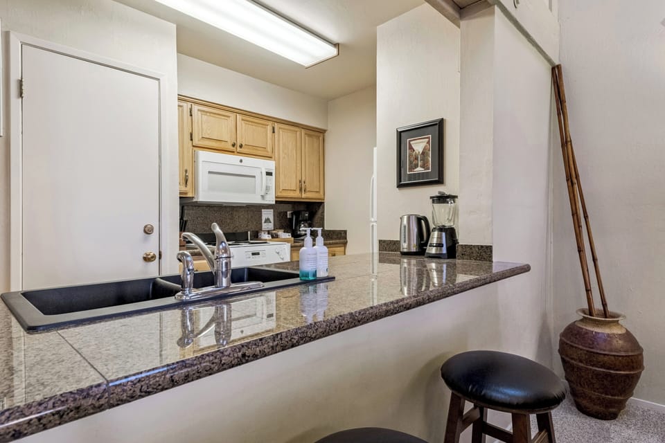 Your fully equipped kitchen features granite countertops, modern appliances, and everything you need to create memorable meals during your stay.