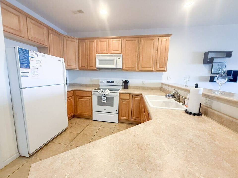 Fully equipped open-concept kitchen with spacious countertops and full-size appliances—perfect for easy meals during your Lake of the Ozarks getaway.