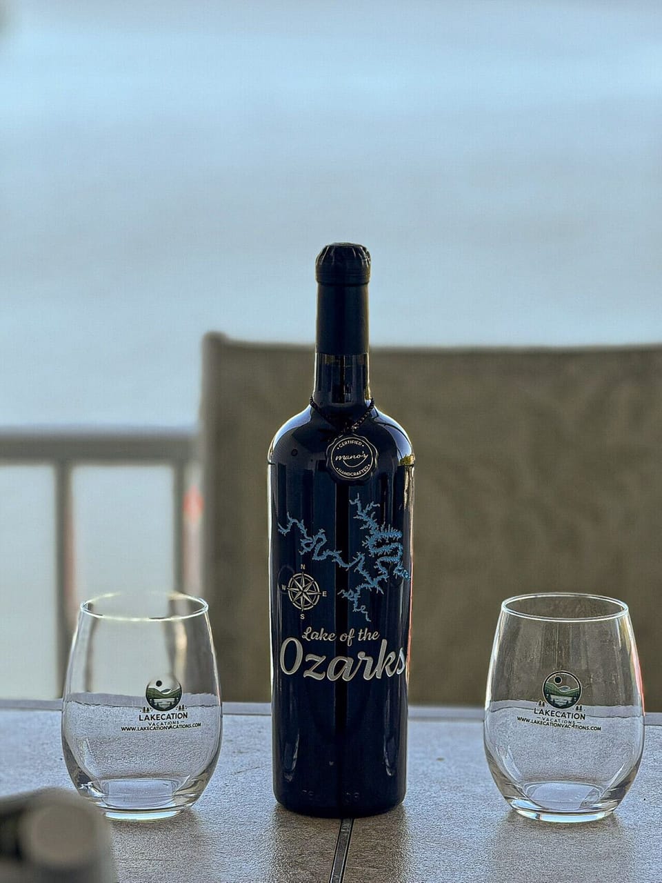 Lakefront balcony seating perfect for wine at sunset—ideal for relaxing and soaking in beautiful Lake of the Ozarks views.
