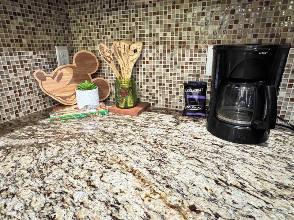 Brew your favorite coffee and enjoy charming Mickey-themed kitchen accents, adding joy to your morning routine