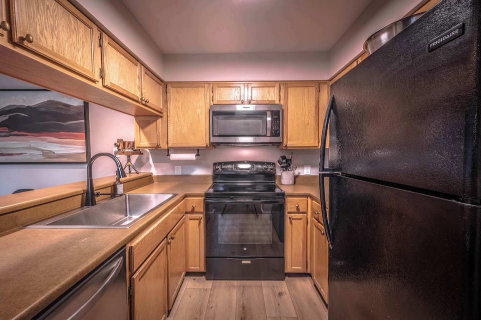Fully equipped kitchen with spacious counters and modern appliances.