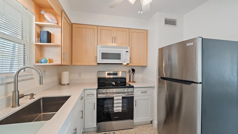 Fully stocked kitchen with cooking essentials for your stay.