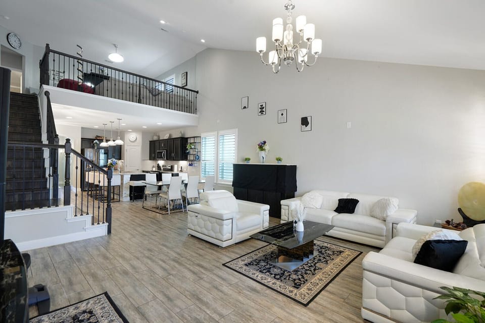 🛋 Living Room “Cathedral ceilings, leather seating, and vibes that feel like vacation.”