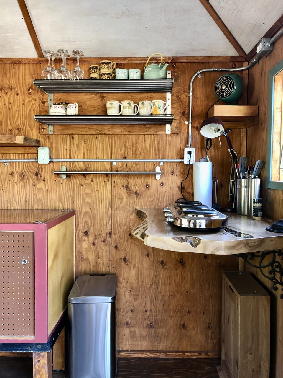 Cozy kitchenette with rustic charm and open shelving