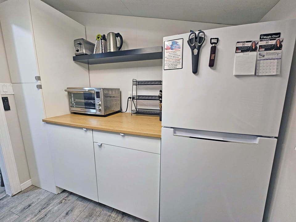 Cooking area with appliances and pantry; fully equipped, typical kitchen. 