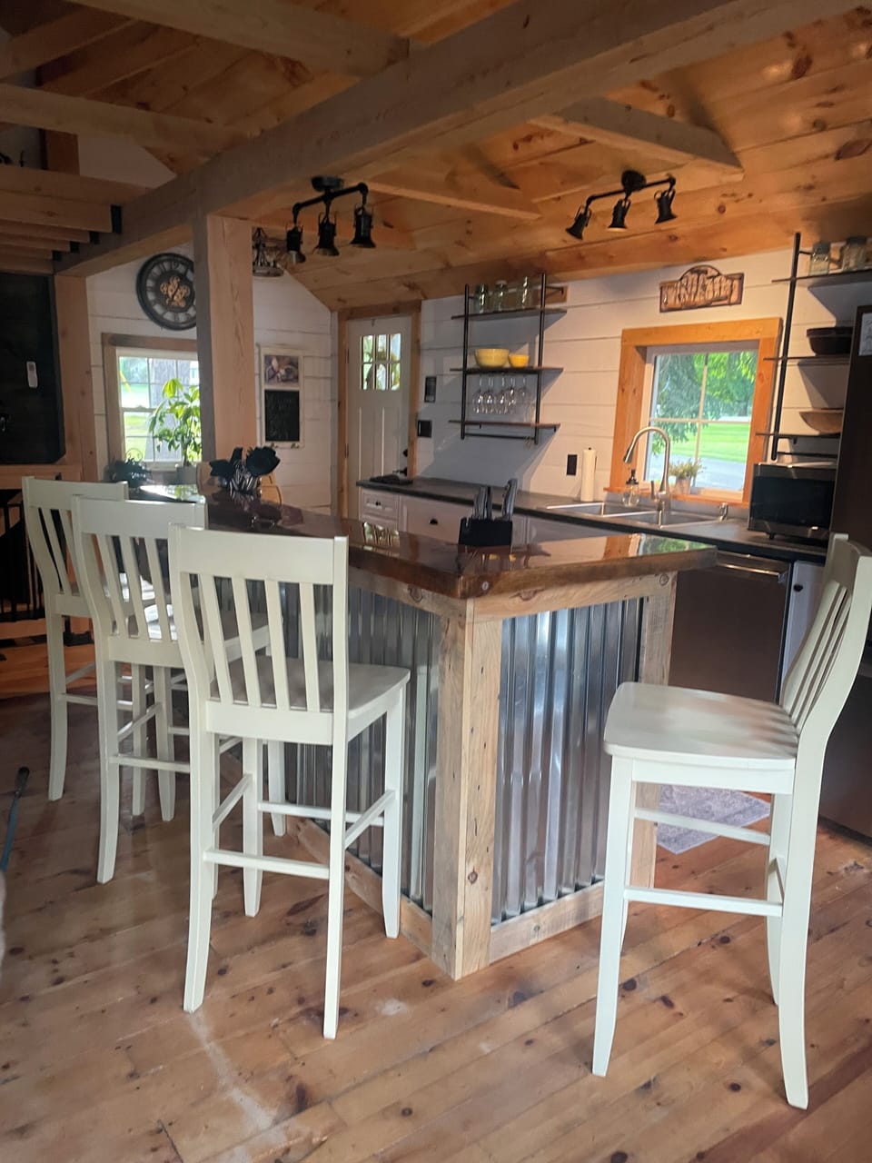 4 high bar stools at kitchen counter.