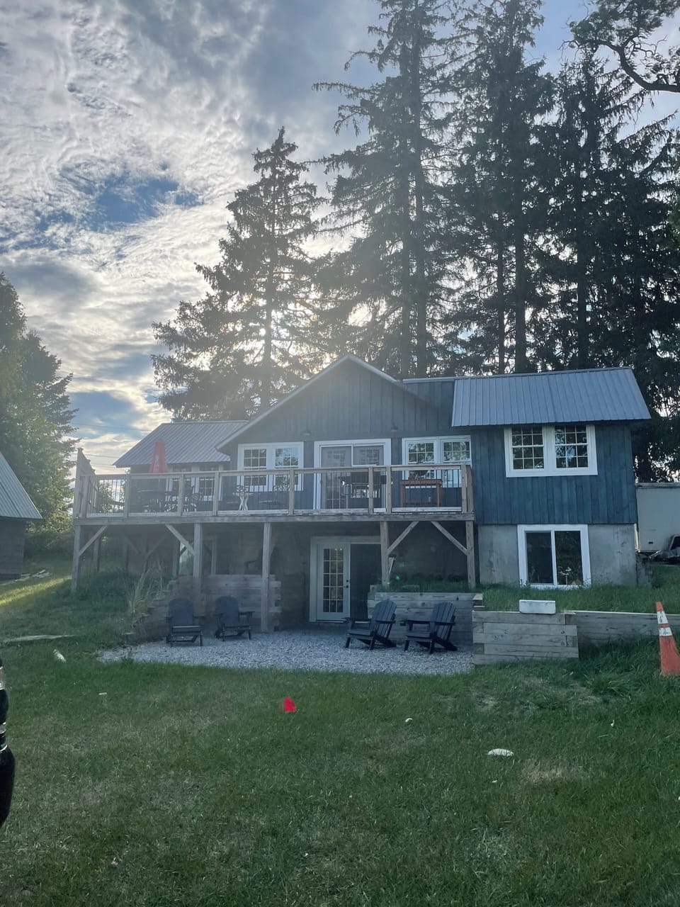 Outside view of the cabin with a stone patio.