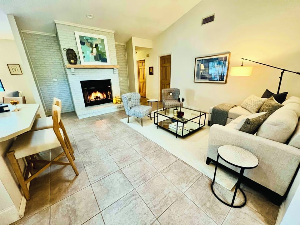 cozy and bright living area open to the kitchen.