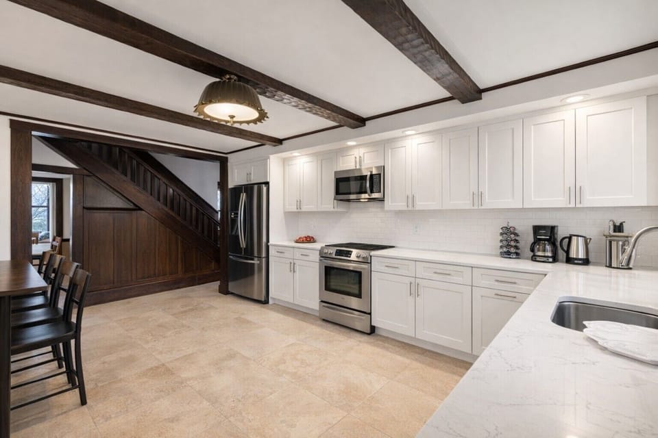 Contemporary design with sleek appliances and beautiful natural light! Perfect f