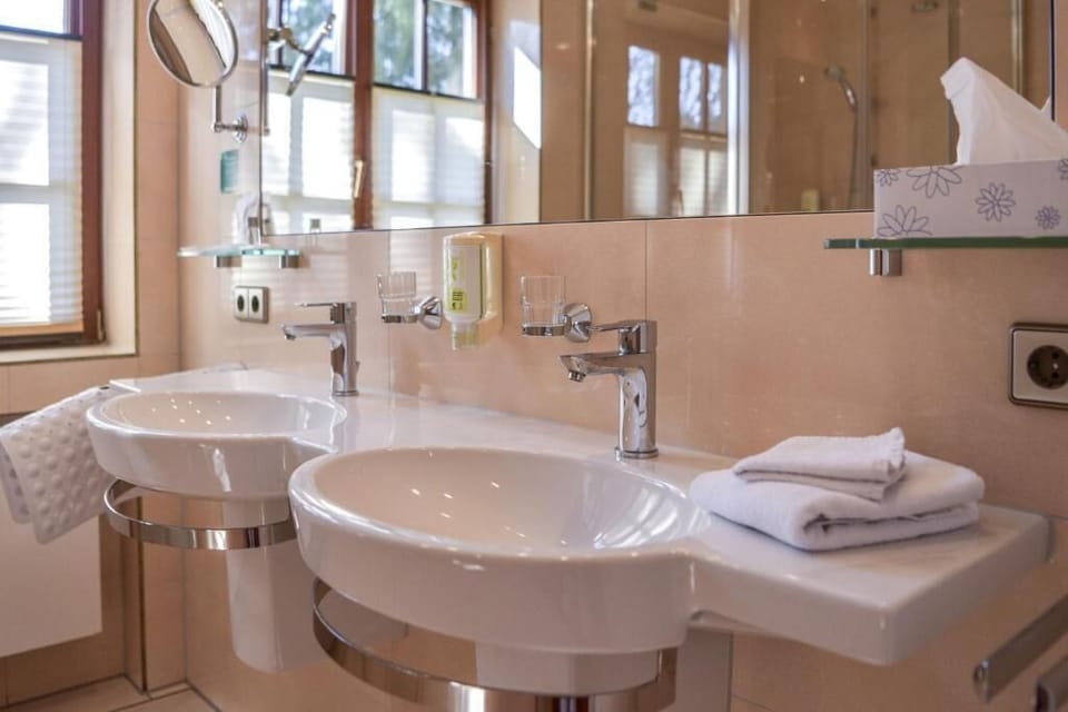 Family Room, Courtyard View | Bathroom | Free toiletries, hair dryer, slippers, towels
