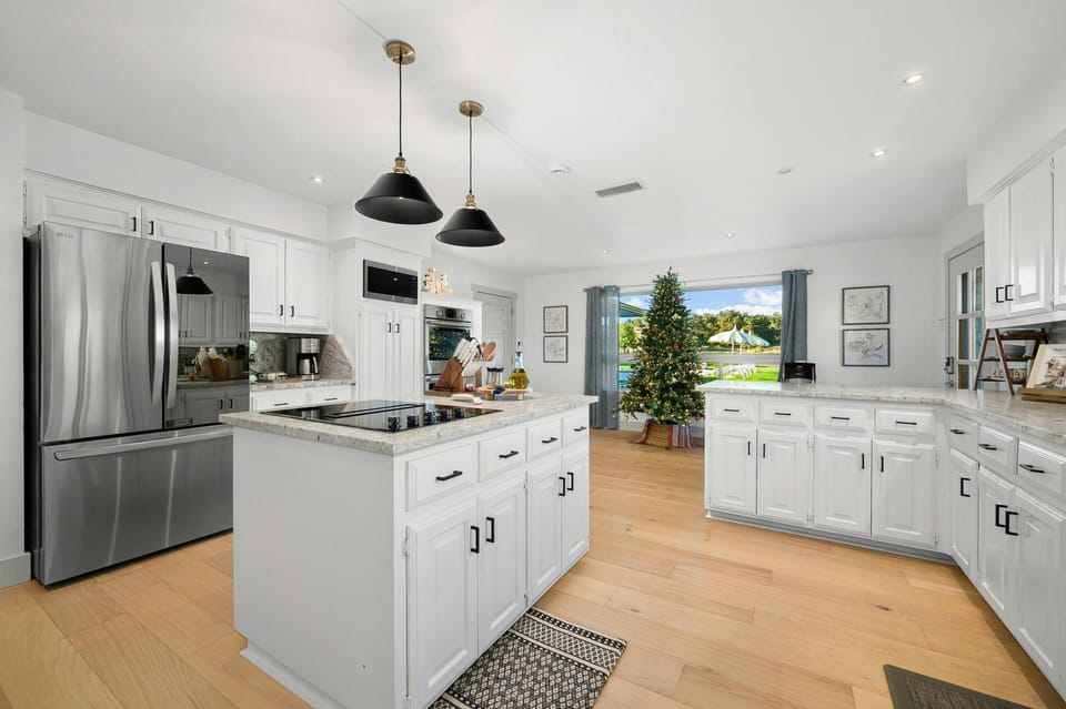 Kitchen – refrigerator, microwave, double wall ovens, induction stove