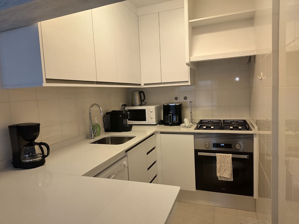 A modern and fully equipped kitchen where you can comfortably prepare your meals.
