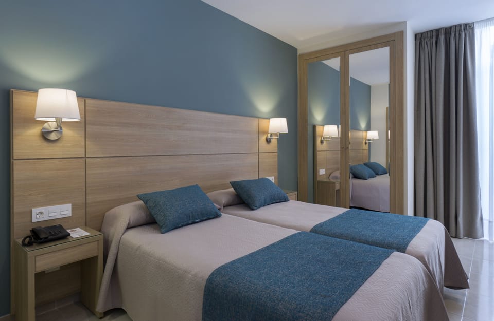 Desk, blackout drapes, rollaway beds, free WiFi