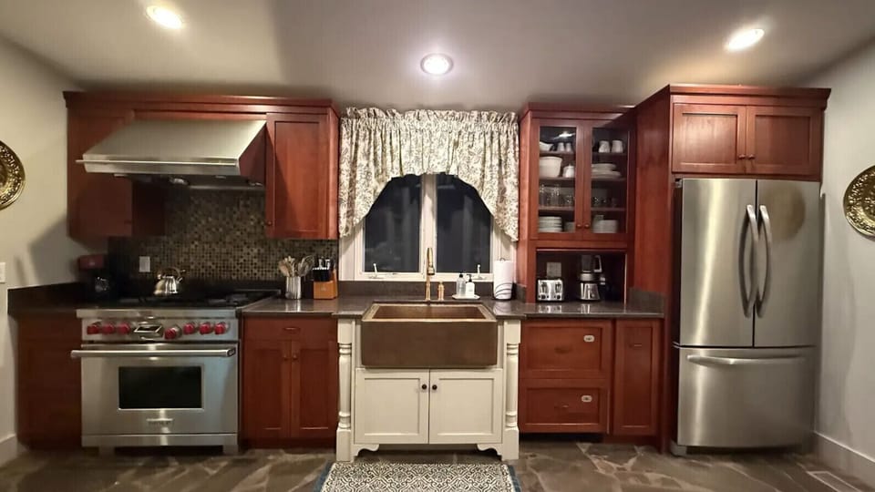 Fully equipped kitchen featuring cookware, appliances, and dining essentials