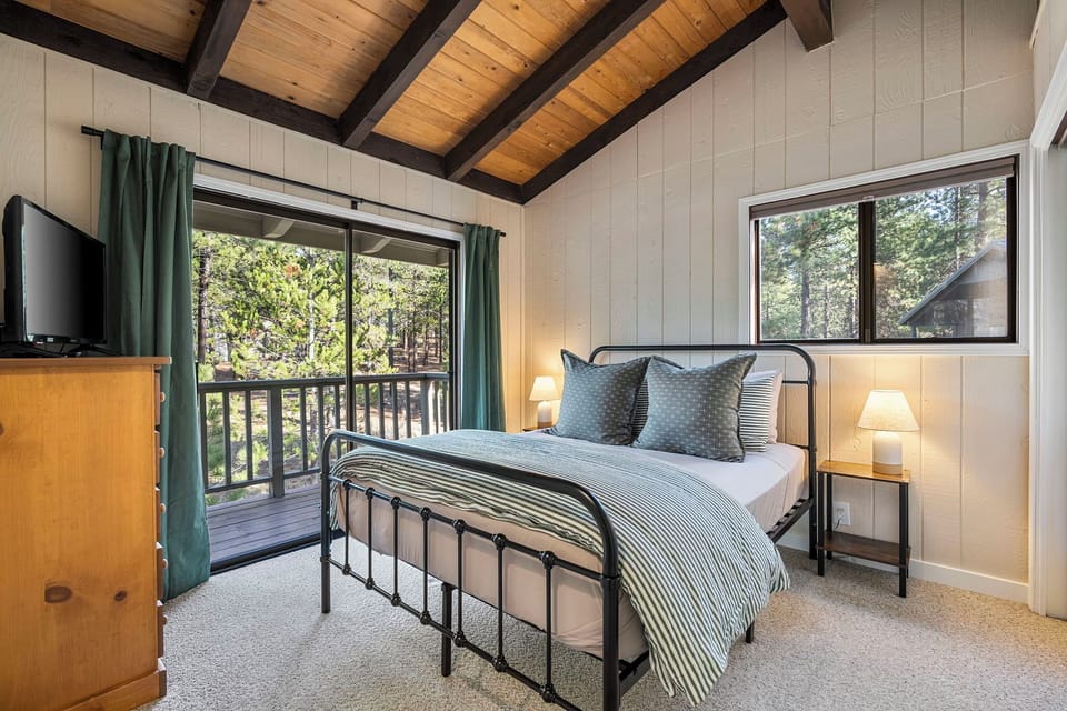 Bedroom 1 w/vaulted ceilings, smart TV, balcony, blackout shades