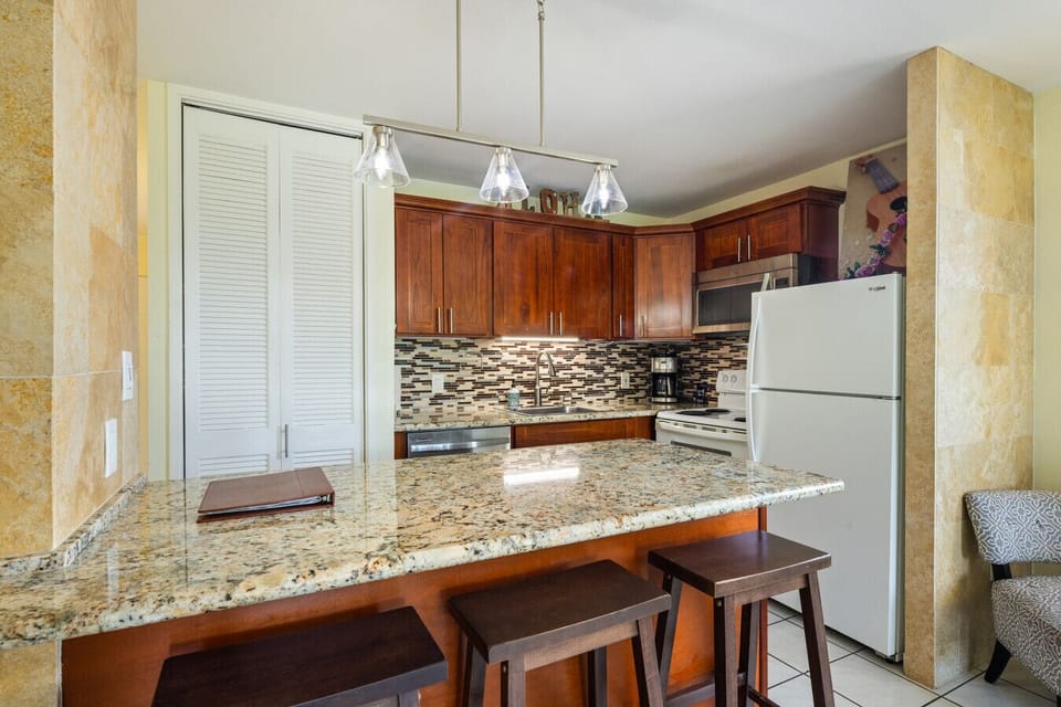 Charming kitchen corner w/ stone backsplash & handy storage.