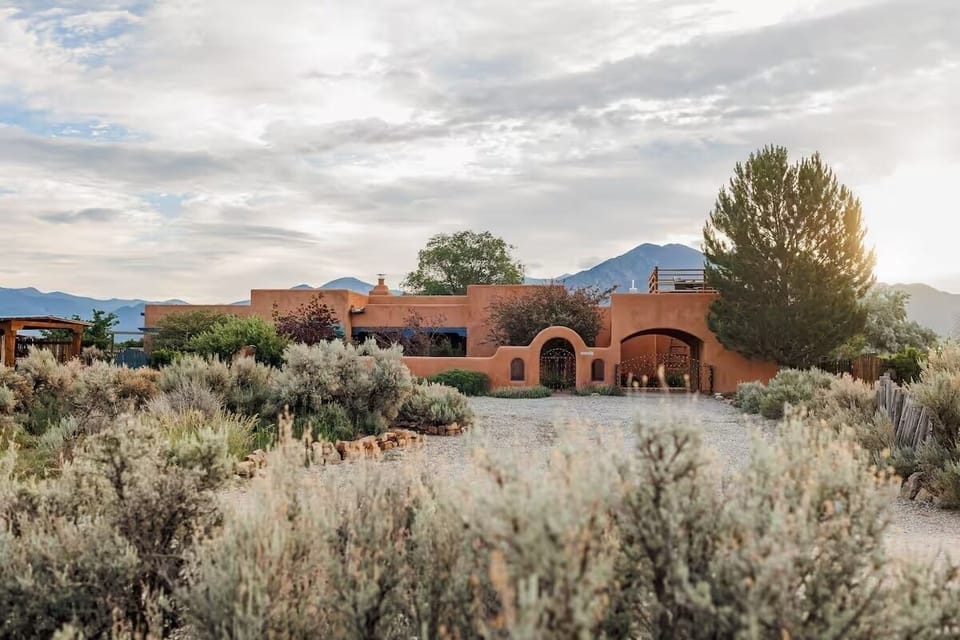Welcome to a serene desert retreat set against the Sangre de Cristo Mountains.