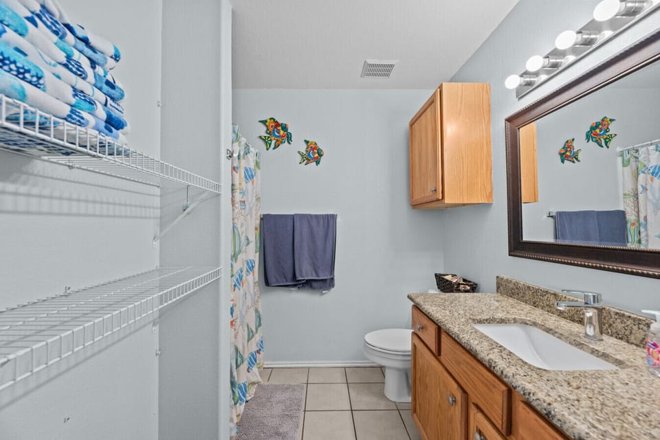 Refresh after a beach day in your bright, coastal-style bathroom