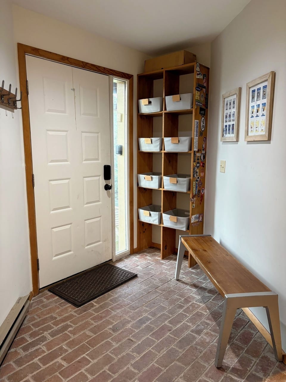 Mudroom complete with storage bins, bench, and 8ft long hook rack for coats