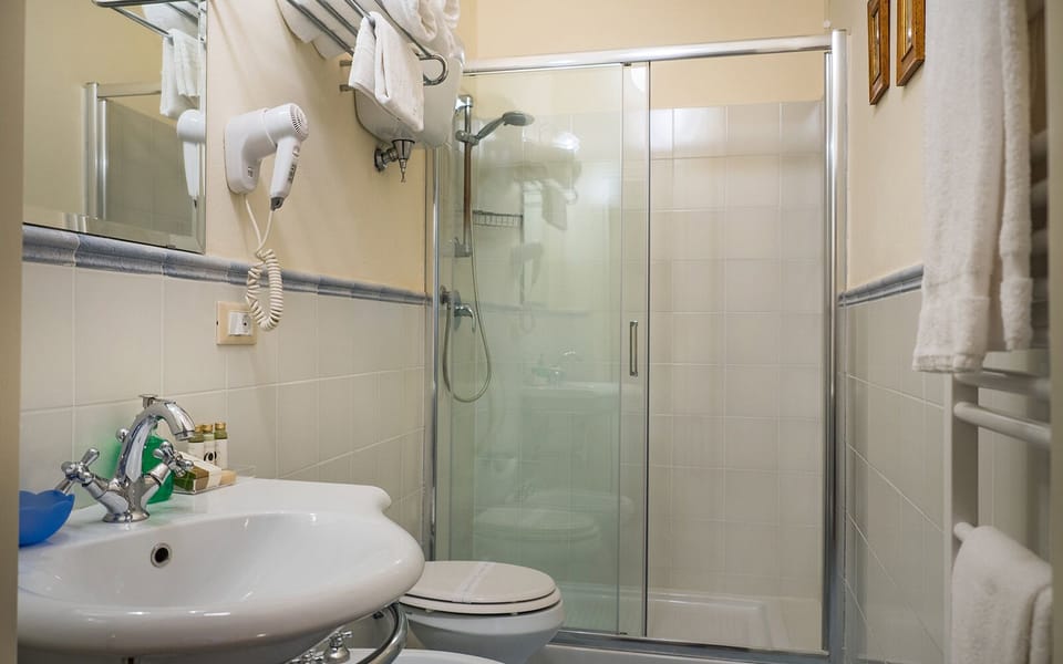 Comfort Double or Twin Room | Bathroom | Shower, free toiletries, hair dryer, slippers