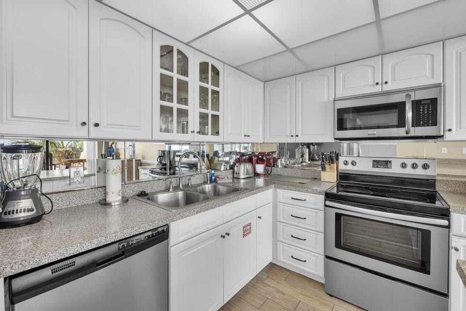 Modern kitchen stocked with essentials — enjoy coffee, cocktails, or home-cooked meals
