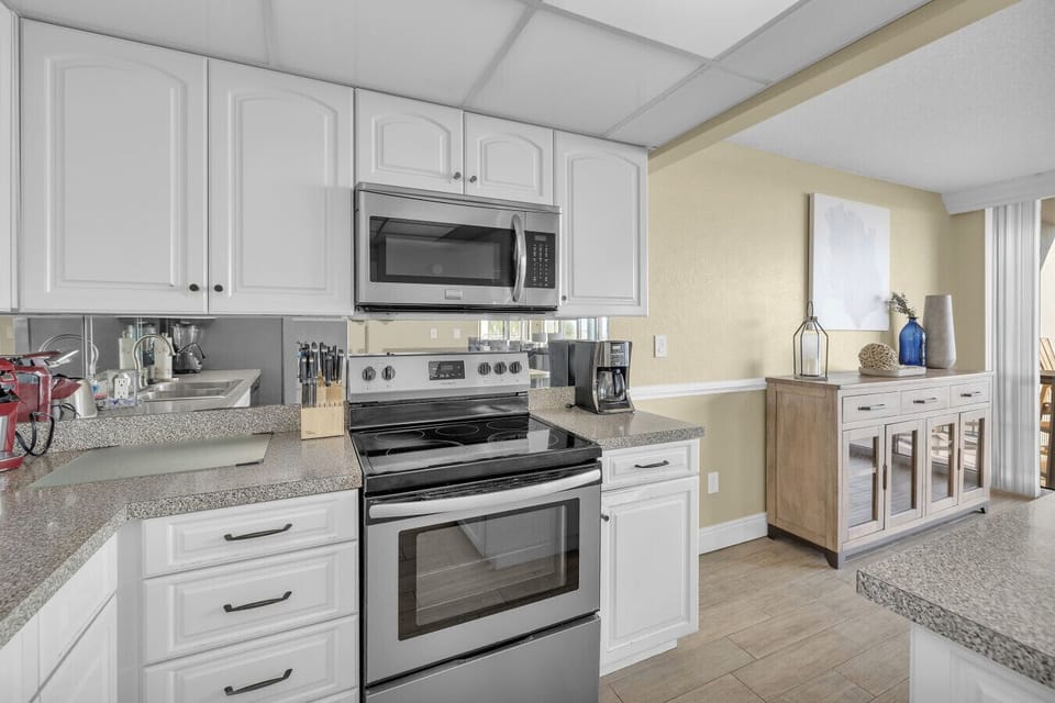 Modern kitchen stocked with essentials — enjoy coffee, cocktails, or home-cooked meals