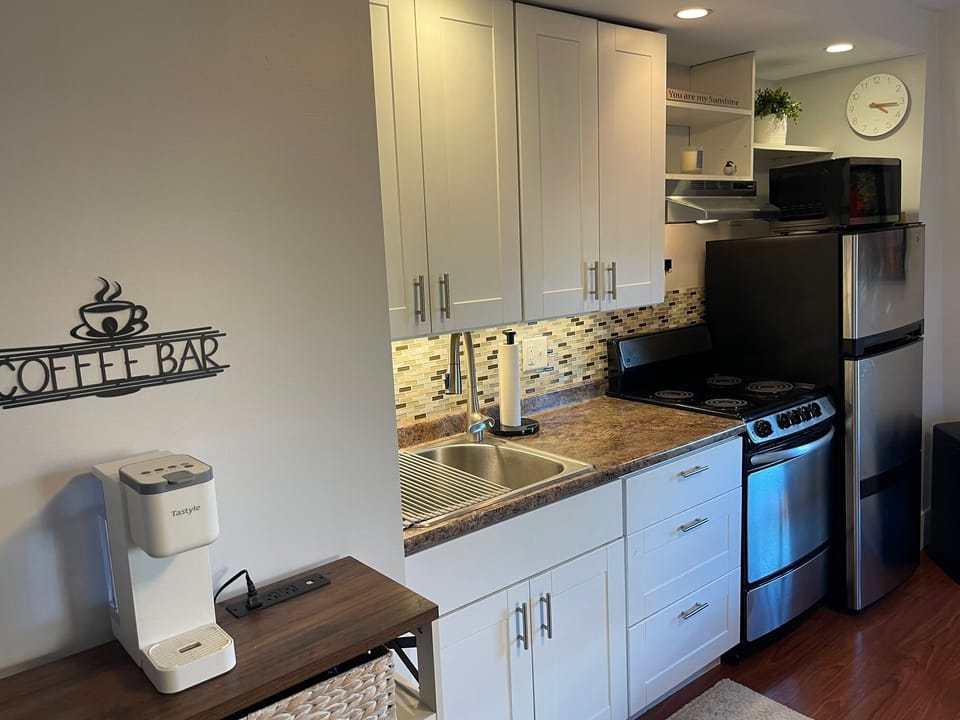 Coffee bar has Keurig, French press and espresso maker. Coffee and tea provided