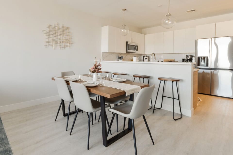 Dining table, flat ware, dinner ware, stools, wall art, dining chars