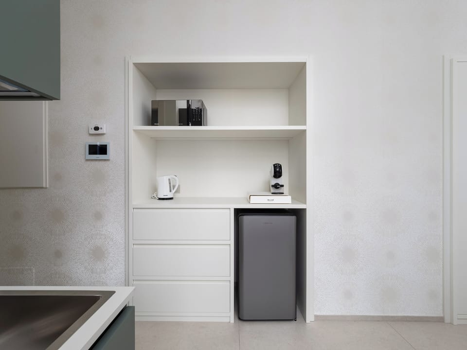 Luxury Suite, Balcony, City View | Private kitchen | Espresso maker, coffee/tea maker, electric kettle