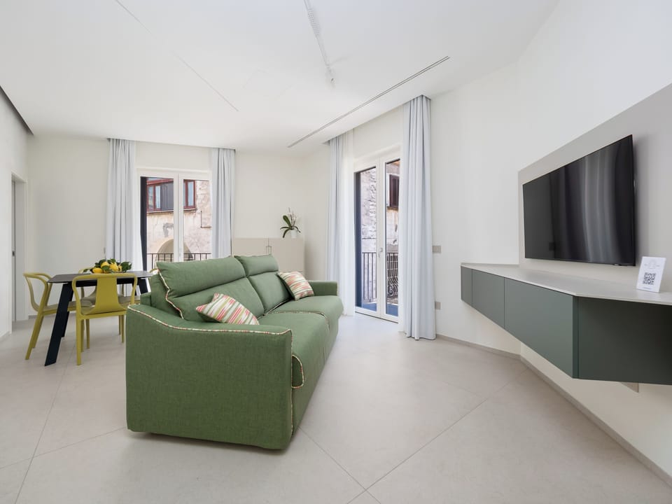 Luxury Suite, Balcony, City View | Living area | 46-inch Smart TV with digital channels, Netflix, streaming services