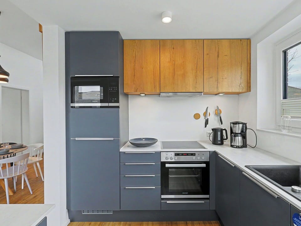 Kitchen Appliance, Kitchen, Countertop, Cabinetry, Furniture, Major Appliance, Flooring, Interior Design, Home Appliance, Wood