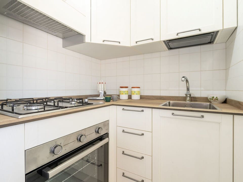 Kitchen, Countertop, Kitchen Appliance, Major Appliance, Wood, Interior Design, Cabinetry, Flooring, Kitchen Stove, Stove