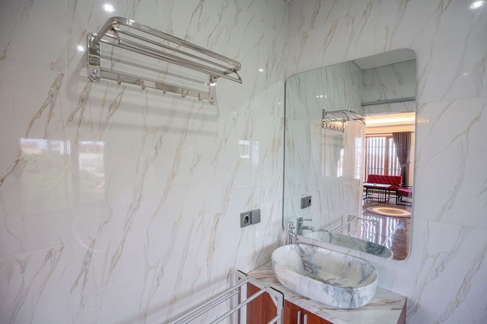 Rainfall showerhead, towels, soap, shampoo