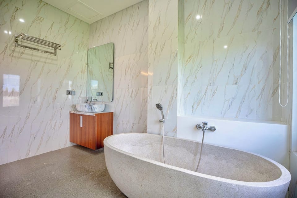 Rainfall showerhead, towels, soap, shampoo