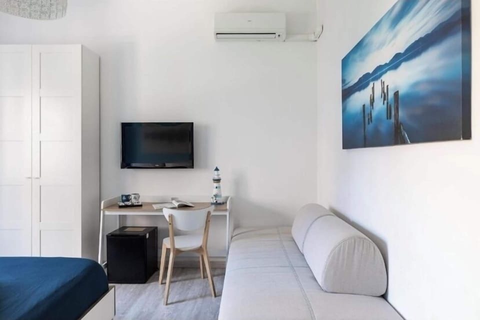 Standard Triple Room | Blackout drapes, soundproofing, iron/ironing board, free WiFi