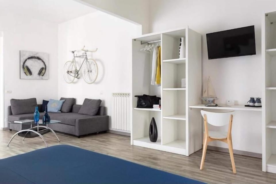 Luxury Quadruple Room, Balcony | In-room safe, desk, laptop workspace, soundproofing