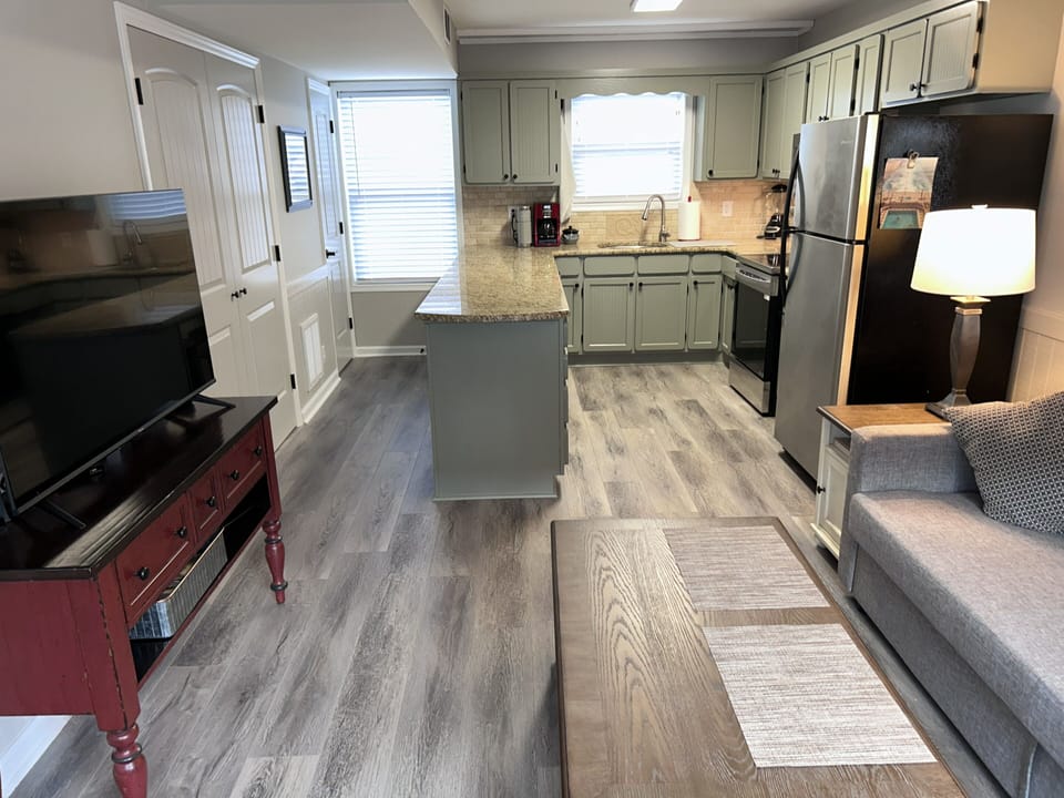 Open-concept living with an updated kitchen and cozy lounge area.