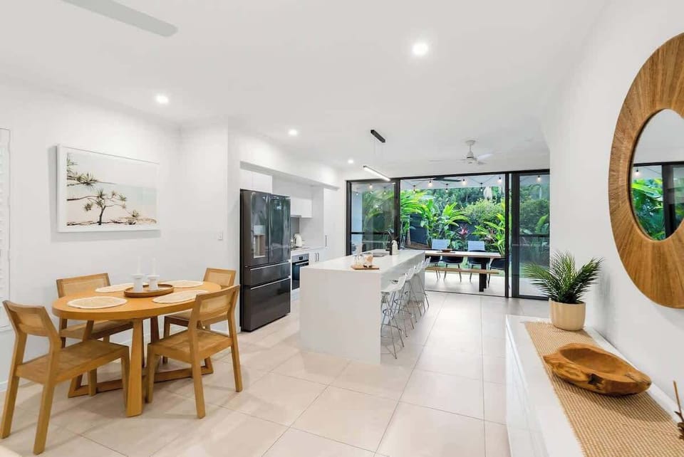 Gather around the indoor dining table for easy breakfasts or quick bites before heading out to enjoy long, leisurely meals in the alfresco area.