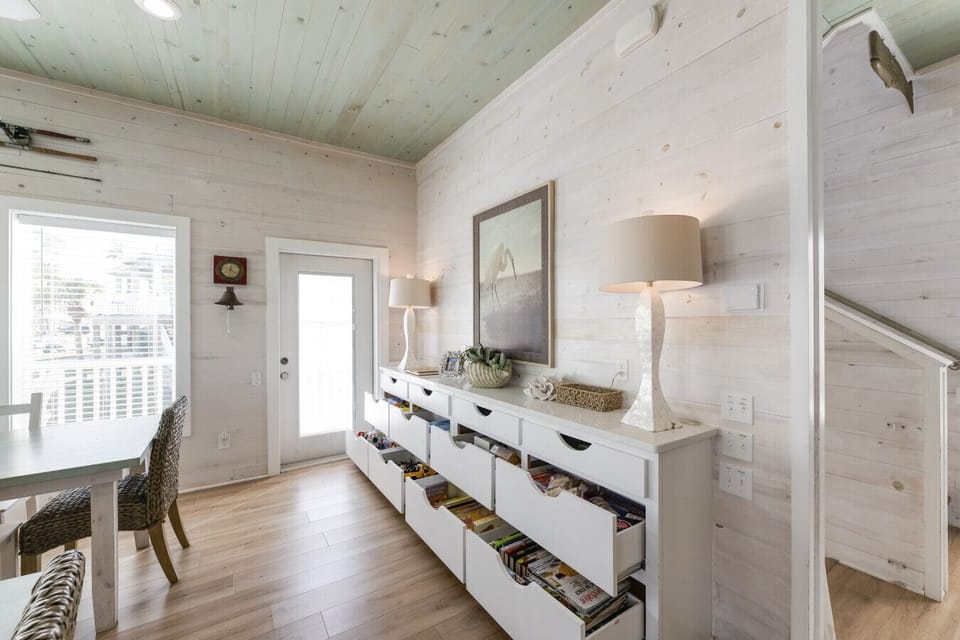 “A welcoming corner with coastal décor and plenty of games for family fun.”